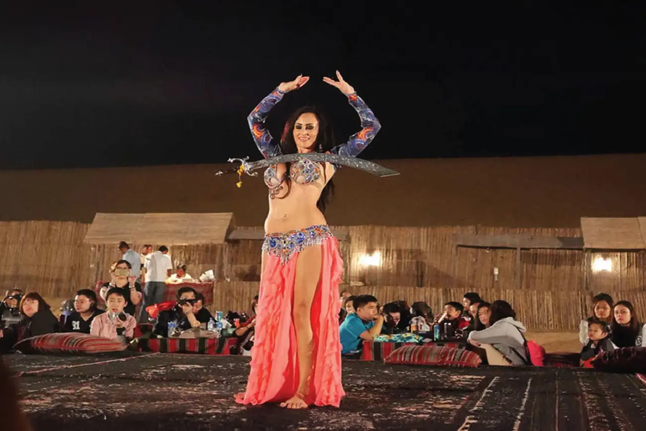 Belly dance performance at a desert camp
