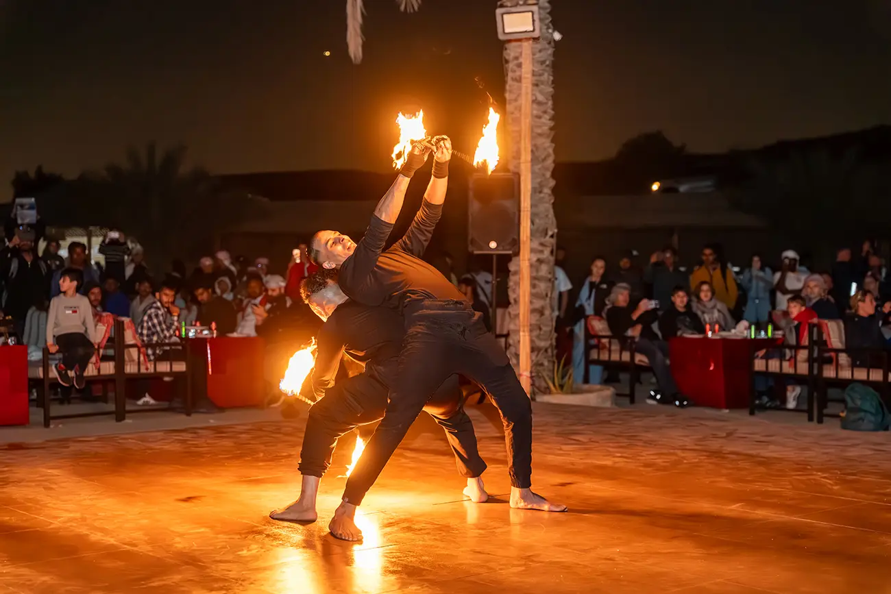 Fire show performance at a desert camp